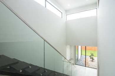 Example of a minimalist painted floating open staircase design in Dallas