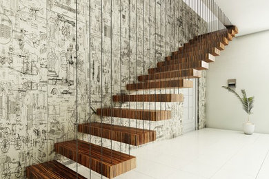 Réalisation d'un escalier flottant design avec des marches en bois.
