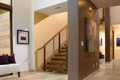 Example of a large wooden straight open staircase design in Salt Lake City