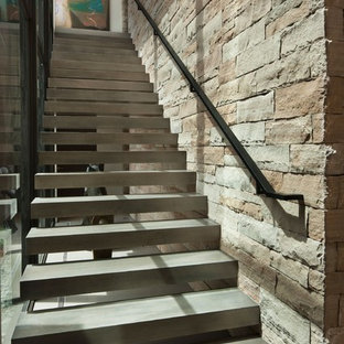 Inspiration for a modern concrete floating open and metal railing staircase remodel in Other
