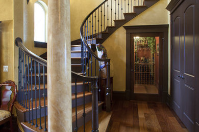 Inspiration for a mediterranean wooden curved staircase remodel in Seattle