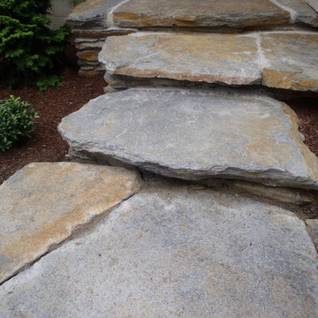 Front entries with native stone stairways