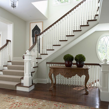 Front Entry and Main Staircase with spiral balusters and oval window
