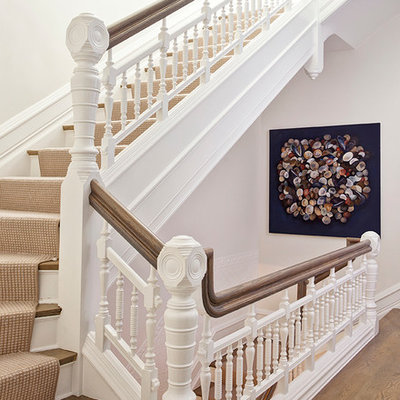 Inspiration for a large transitional wooden l-shaped staircase remodel in Chicago with painted risers