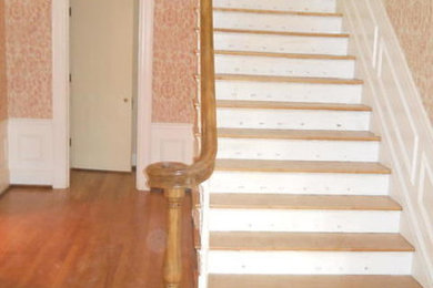 Staircase - traditional wooden staircase idea in Kansas City with painted risers