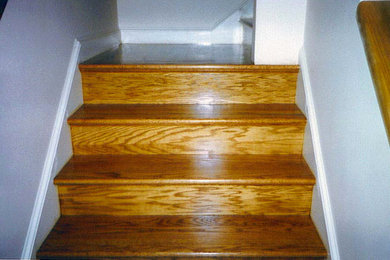 Inspiration for a mid-sized timeless wooden l-shaped staircase remodel in Boston with wooden risers