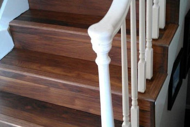 Inspiration for a timeless wooden staircase remodel in Other with wooden risers
