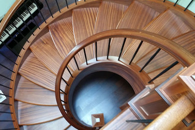 Staircase - mid-sized transitional wooden spiral staircase idea in Seattle with wooden risers