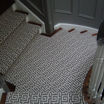 Geometric grey/white wool runner on multi-directional curved staircase
