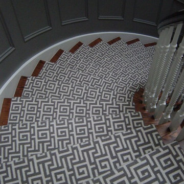 Geometric wool wilton runner on curved stairs