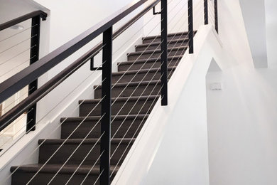 Example of a mid-sized minimalist wooden straight mixed material railing staircase design in San Francisco with wooden risers