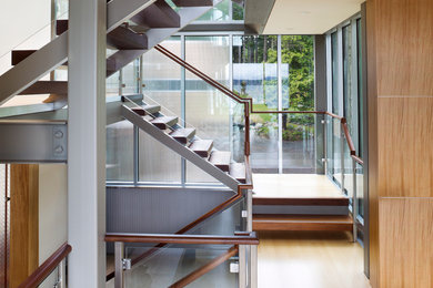Inspiration for a modern wooden floating open staircase remodel in Seattle