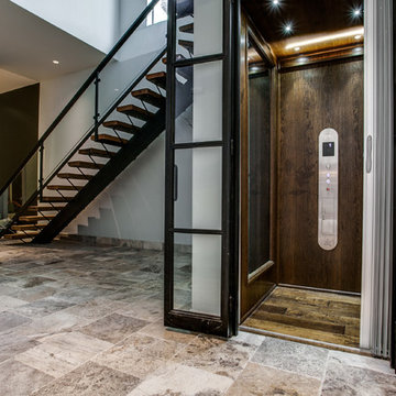 Glass Elevator Doors and Glass Staircase Handrail
