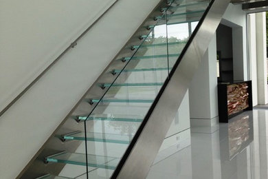 Mid-sized trendy glass straight open staircase photo in Cleveland