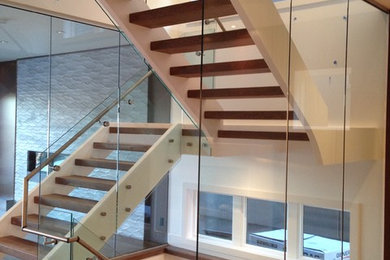 Example of a mid-sized minimalist staircase design in Calgary
