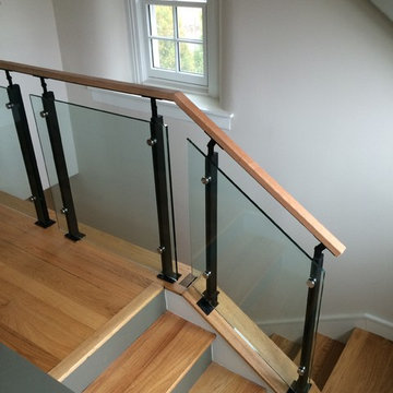 Glass railing with wood handrail