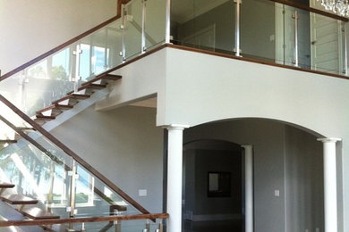 Staircase - large contemporary wooden floating glass railing and open staircase idea in Other