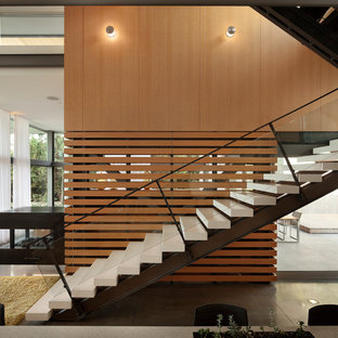 Minimalist concrete straight open staircase photo in Seattle
