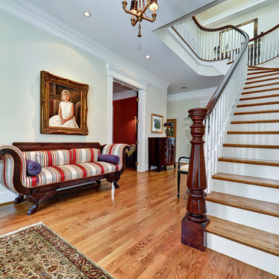 Elegant wooden curved staircase photo in DC Metro