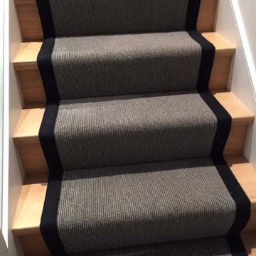 Grey carpet stair runner with black border