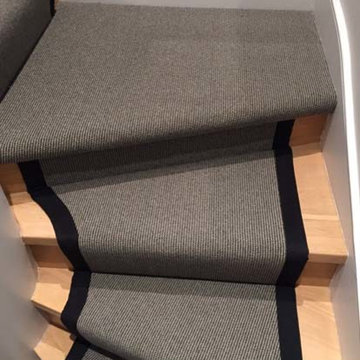 Grey carpet stair runner with black border