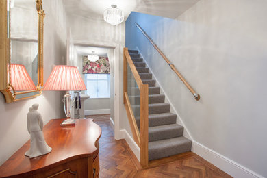 Photo of a contemporary staircase in West Midlands with feature lighting.