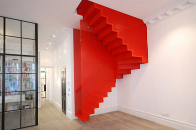 Inspiration for a contemporary metal staircase in London with metal risers.