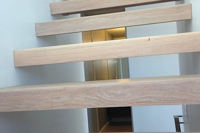 Staircase - contemporary wooden straight staircase idea in San Francisco with wooden risers