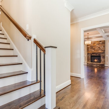 Hardwood staircase with expansive hardwood floors