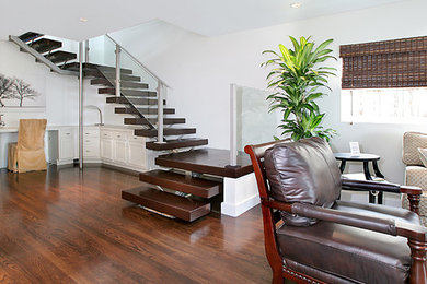 Inspiration for a large contemporary wooden u-shaped open staircase remodel in Albuquerque