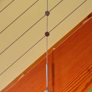 Ejemplo de escalera recta, actual, pequeña, sin contrahuella, con escalones de madera