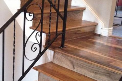 Small elegant wooden l-shaped staircase photo in Denver with wooden risers