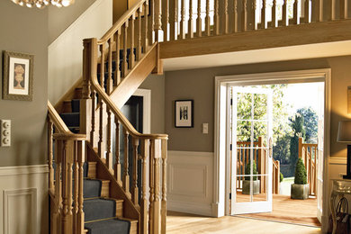 Photo of a medium sized traditional l-shaped staircase in Other.
