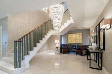 Design ideas for a large classic curved staircase in London with feature lighting.