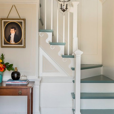 Example of a classic painted l-shaped staircase design in Boston with painted risers
