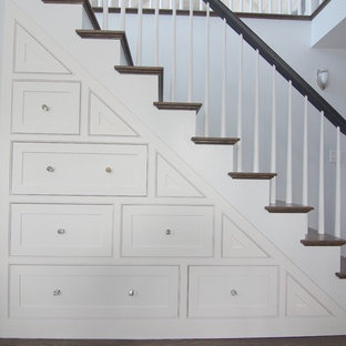 Example of a large transitional wooden straight wood railing staircase design in Boston with painted risers