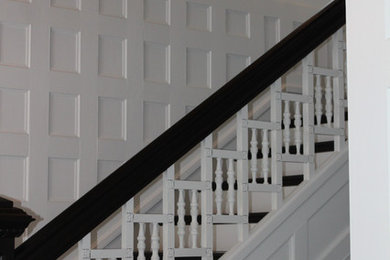 Staircase - mid-sized transitional wooden l-shaped staircase idea in Indianapolis with painted risers