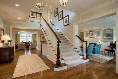 Design ideas for a medium sized traditional wood straight wood railing staircase in Philadelphia with painted wood risers and feature lighting.