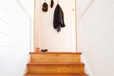 Small danish wooden straight staircase photo in San Francisco with wooden risers