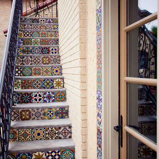 Staircase - small mediterranean staircase idea in Dallas with tile risers