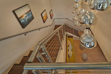 Example of a large transitional wooden l-shaped staircase design in Tampa with wooden risers