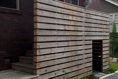 Exemple d'un petit escalier chic en L avec des marches en bois et des contremarches en bois.
