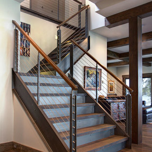 Large urban wooden l-shaped staircase photo in Detroit with metal risers