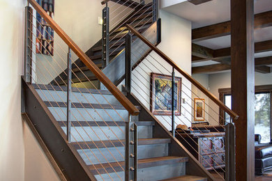 Large urban wooden l-shaped staircase photo in Detroit with metal risers