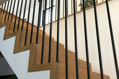 Example of an arts and crafts wooden straight mixed material railing staircase design in Toronto with wooden risers