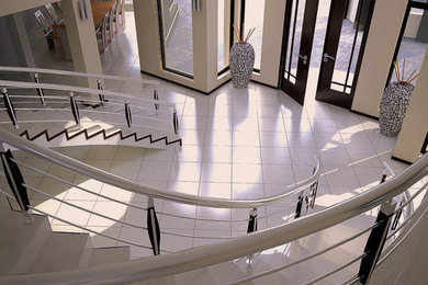 Example of a large trendy tile spiral staircase design in Other with metal risers