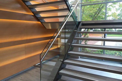 Mid-sized trendy tile u-shaped open staircase photo in Vancouver