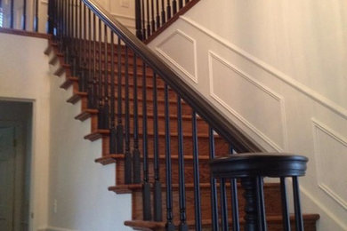 Example of a large wooden staircase design in Seattle