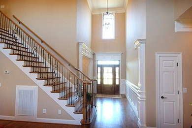Staircase - mid-sized traditional wooden straight metal railing staircase idea in Nashville with painted risers