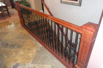 Medium sized classic carpeted straight wood railing staircase in Salt Lake City with carpeted risers.